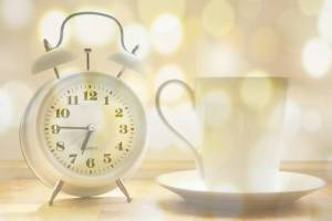 alarm clock and cup of coffee