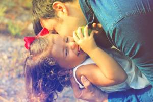 happy child and father protected from the flu
