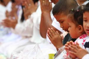 buddhist children in Laos praying