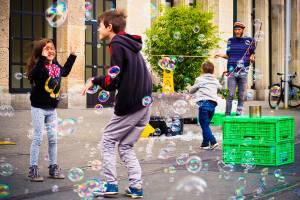 kids playing with bubbles