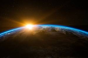 sun rising over the earth taken from the space station